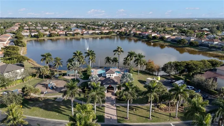 Aerial view of property's location with nearby suburban area and a nearby body of water
