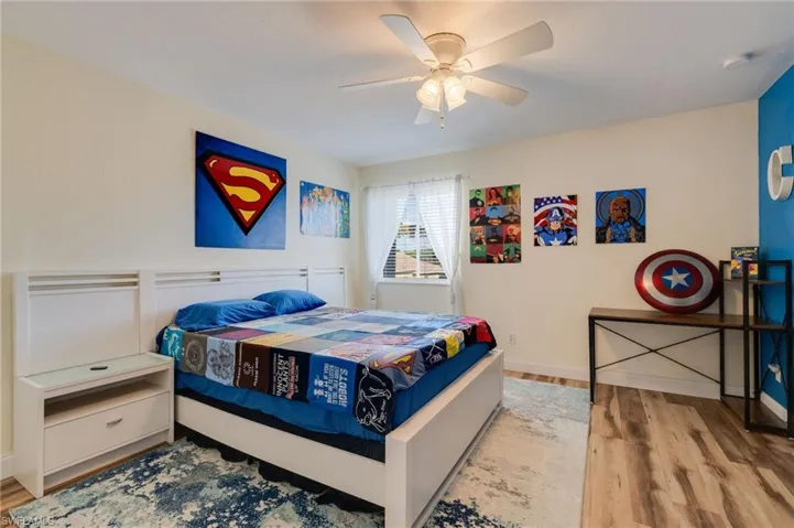 Bedroom featuring light wood-type flooring and ceiling fan