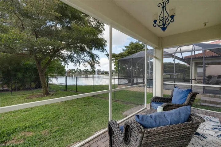 Sunroom / solarium with a water view