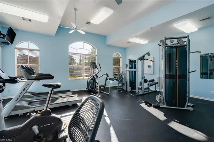 Gym featuring a ceiling fan