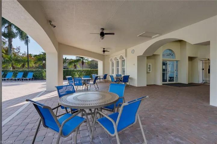 View of patio / terrace with outdoor dining area, ceiling fan, and french doors