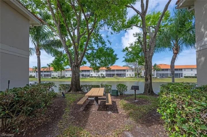 View of yard with a residential view and a water view