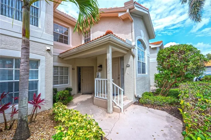 Doorway to property with stucco siding