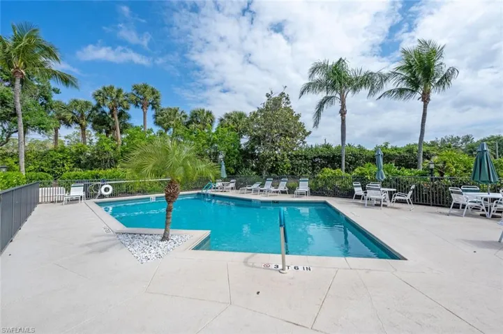 Pool featuring a patio area and fence