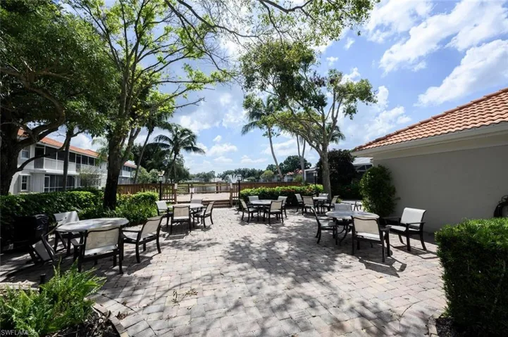 View of patio featuring fence