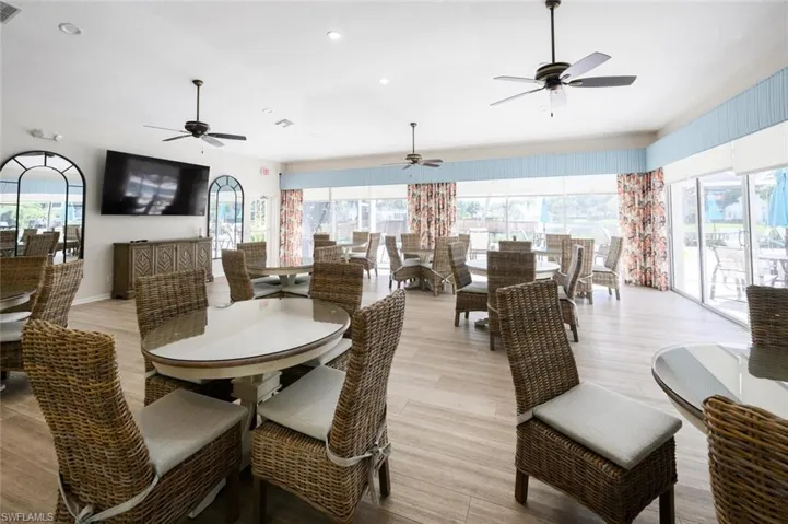 Dining space with light wood finished floors, plenty of natural light, and visible vents