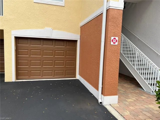 Garage featuring aphalt driveway