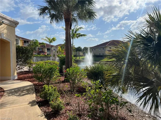 Water view with fence and a residential view