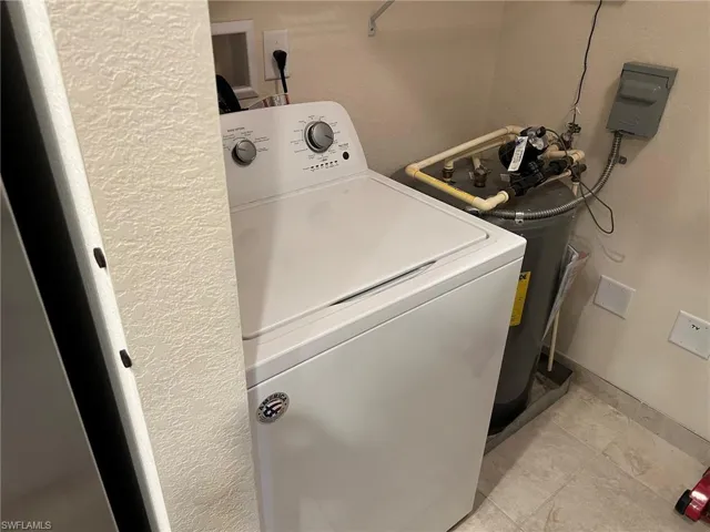 Laundry room featuring washer / clothes dryer and laundry area
