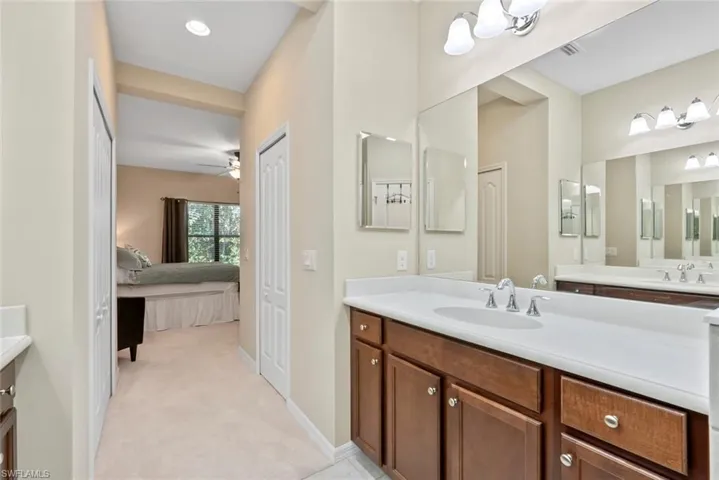 Bathroom featuring ceiling fan and vanity