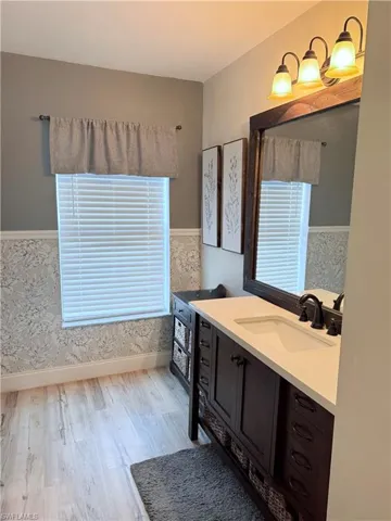 Bathroom with vanity and light wood-type flooring