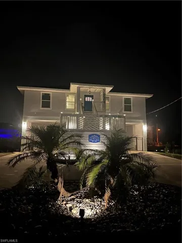 View of front of house featuring concrete driveway