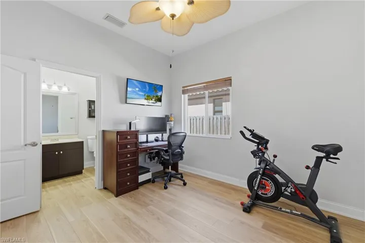 Office space featuring light wood-type flooring and a ceiling fan