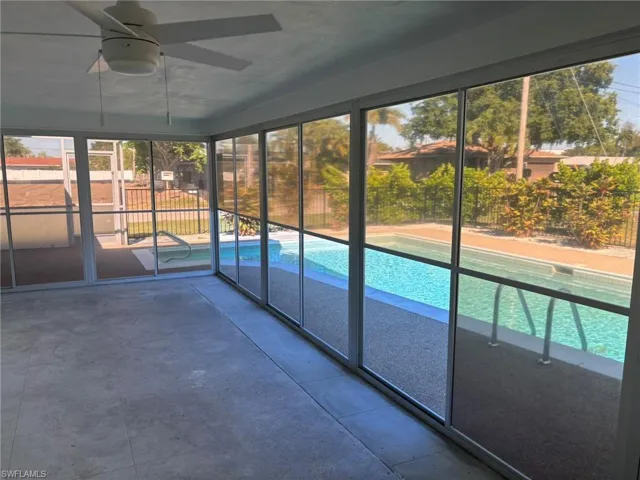 The screened Lanai overlooking the open patio and pool