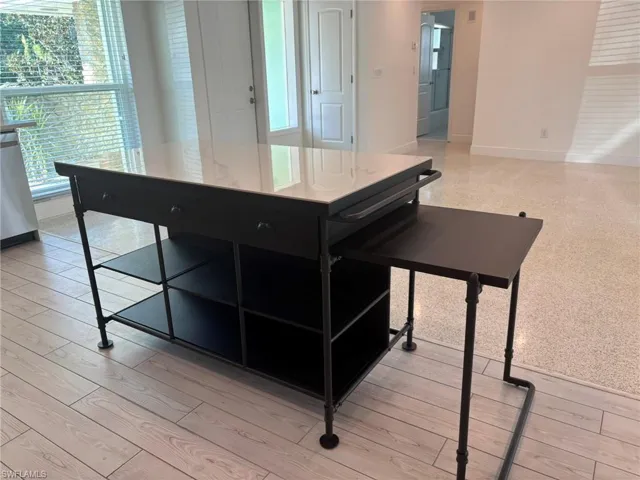 The multi-purpose center island good additional counter space and storage, counter bar on Living room side and the expandable side table for extra seating (side table slides in to make just the counter island)