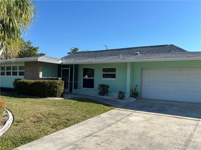 Bring in the new year, Livin' the Life, in SW Cape Coral! This great retro Pool home with Terrazzo floors and bright open floorplan is waiting for you for 2026!