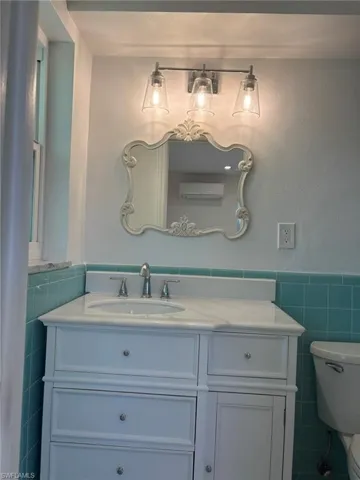 Primary Bath adjacent to Bedroom with single vanity