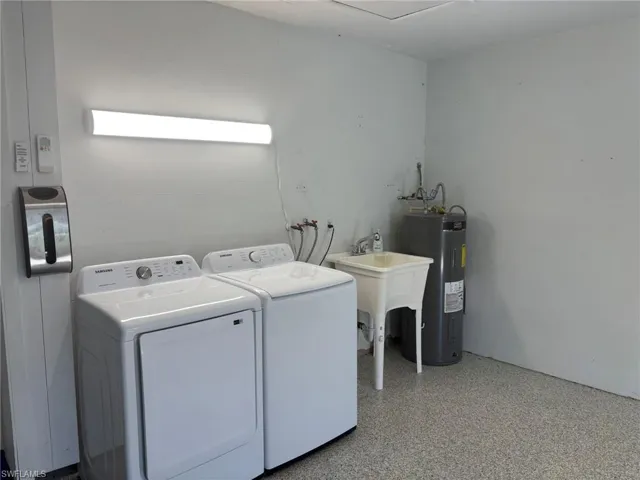 Laundry is located in the garage but well lit, with plenty of space and a utility sink