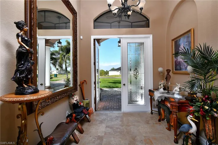 Entryway featuring an inviting chandelier