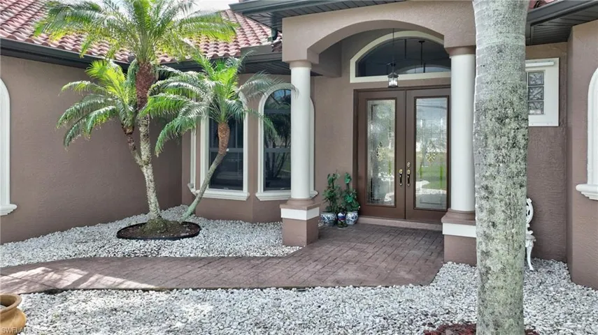 Doorway to property featuring french doors