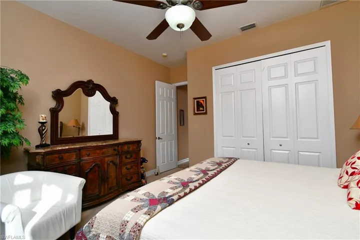 Bedroom featuring a closet and ceiling fan