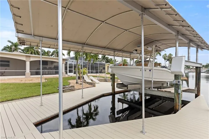 Dock with boat lift and a water view