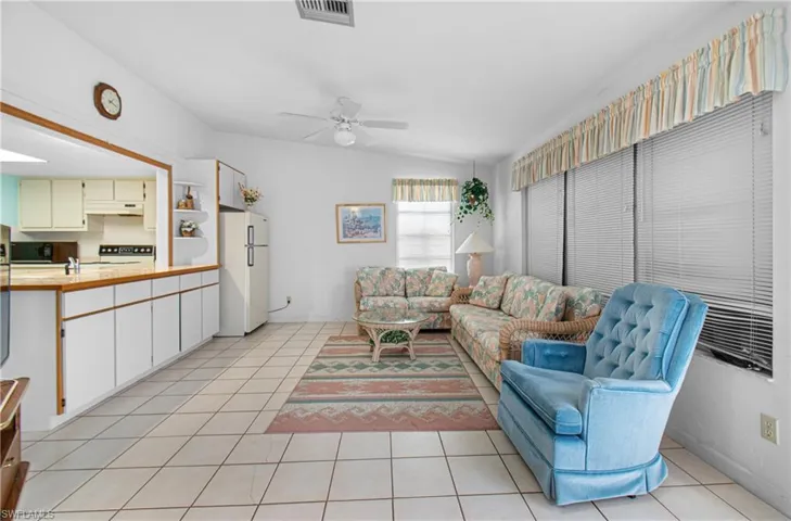 Generous Family Room with cabinets for storage.