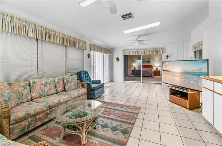 Generous Family Room with a ceiling Fan.