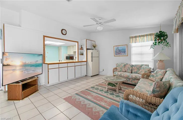 Generous Family Room with cabinets for storage.