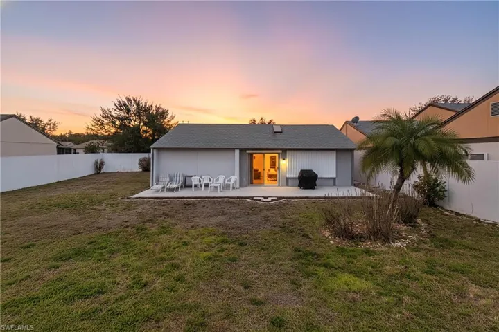 Back of the home. Large backyard.