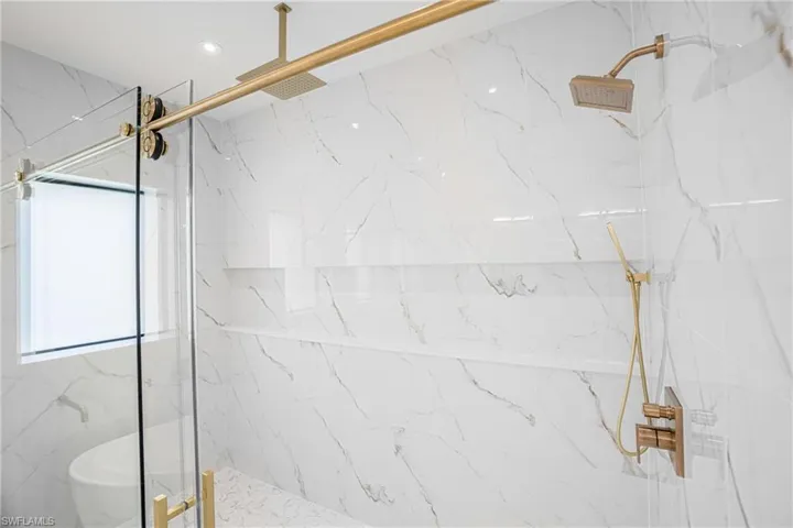 Full bathroom featuring a marble finish shower