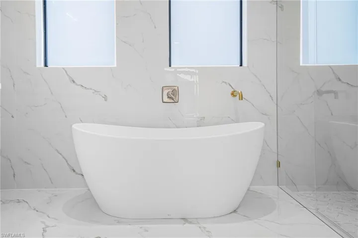 Full bathroom featuring a freestanding tub