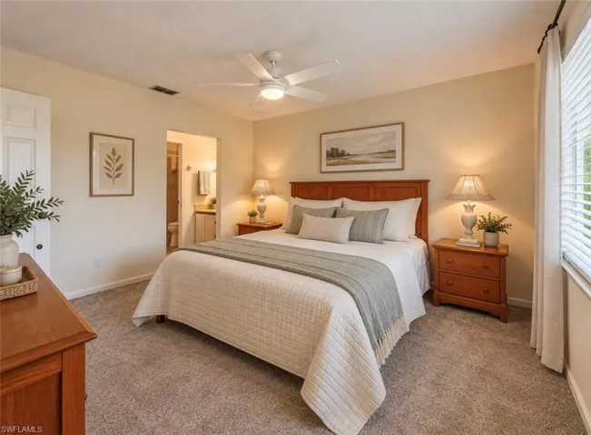 **Virtually staged Bedroom featuring wall-to-wall carpeting, a ceiling-mounted light fixture with fan, and horizontal window blinds