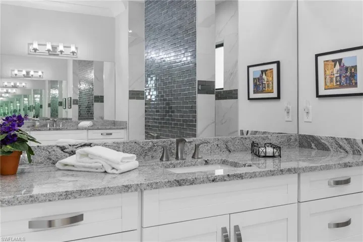 Bathroom featuring vanity and crown molding