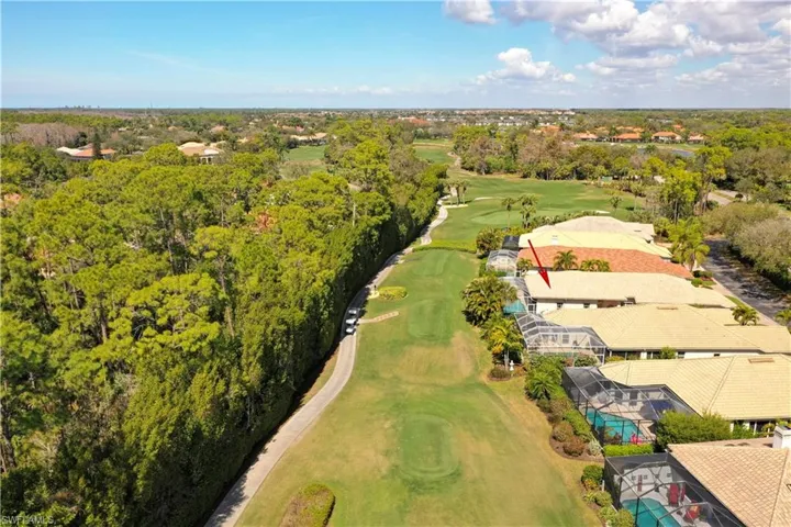 Aerial view of residential area with a golf club