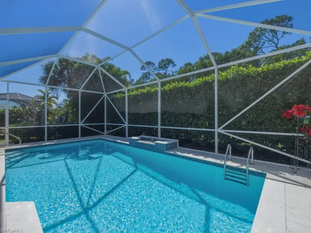 Swimming pool with a sunroom, and a lanai