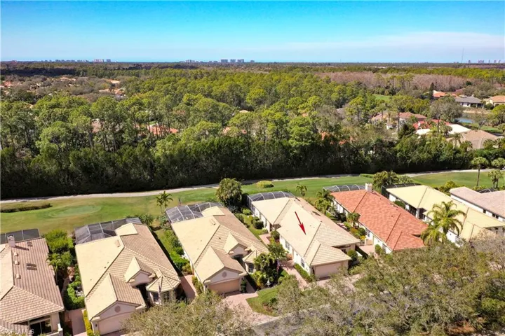 Aerial view of residential area with a golf club