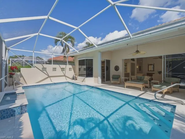 Swimming pool with a sunroom, a patio area, a lanai, and outdoor lounge area