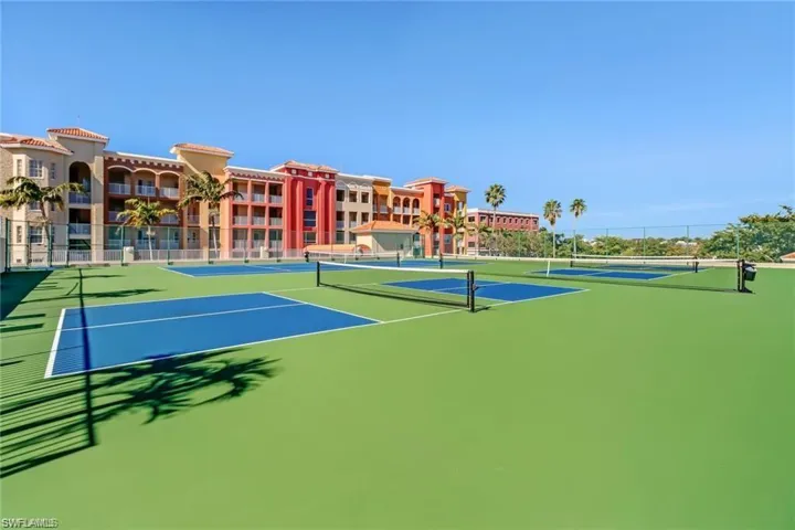 View of tennis court featuring community basketball court