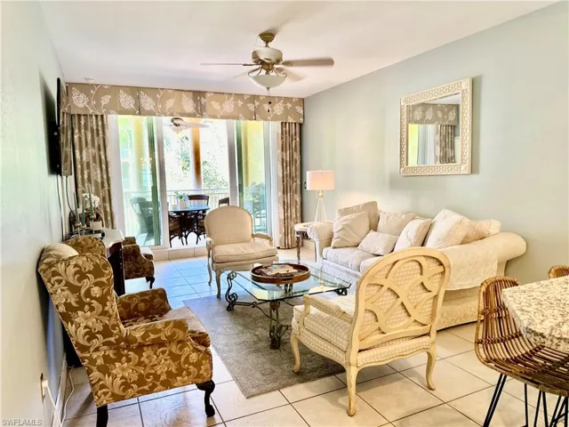 Sitting room featuring light tile patterned floors and ceiling fan