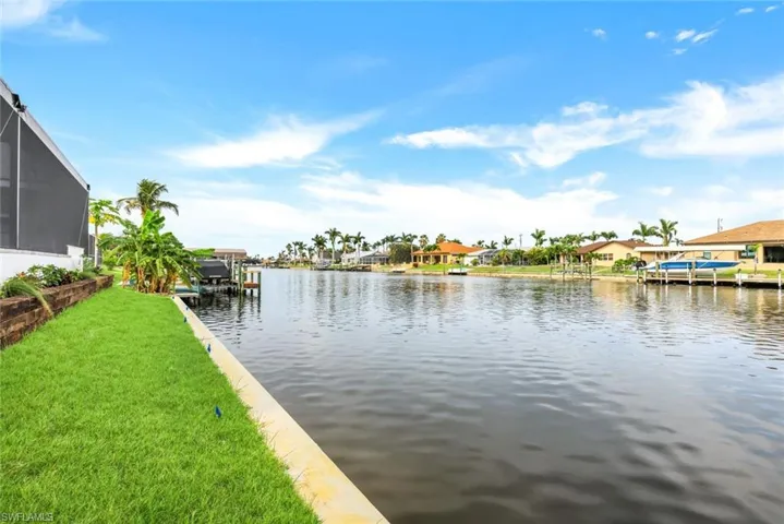 View of water feature with a dock