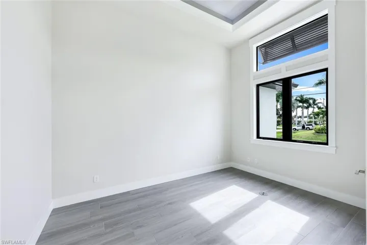 Unfurnished room featuring hardwood / wood-style flooring
