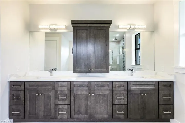 Bathroom with vanity and an enclosed shower