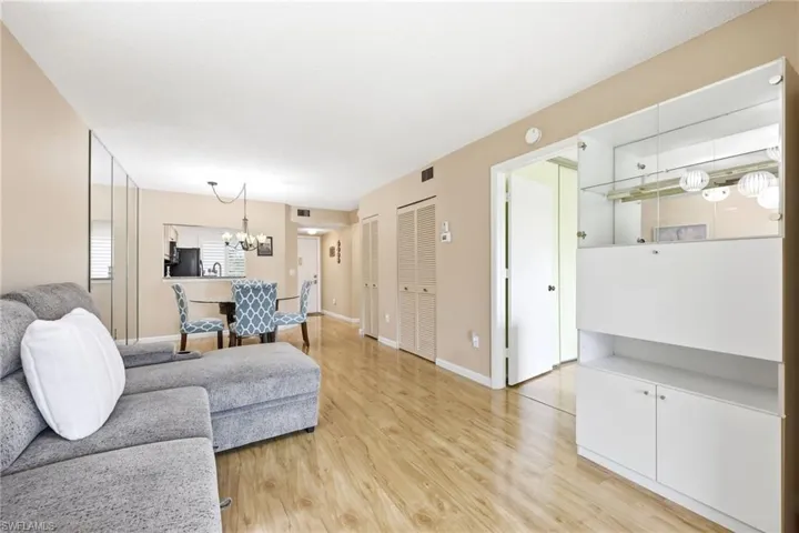 Open-concept living space with wood-finish flooring