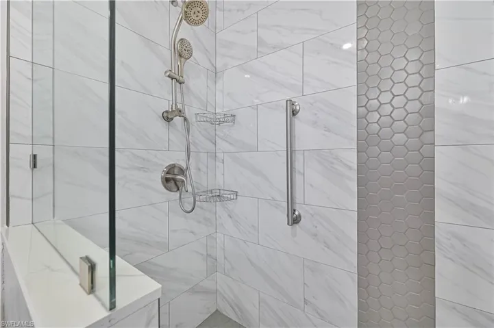 Bathroom with a shower with door