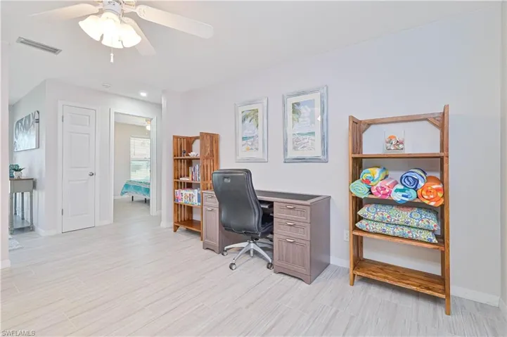 Office area featuring ceiling fan and light hardwood / wood-style floors
