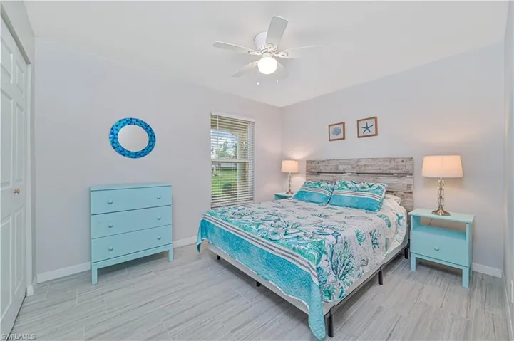 Bedroom with ceiling fan and a closet