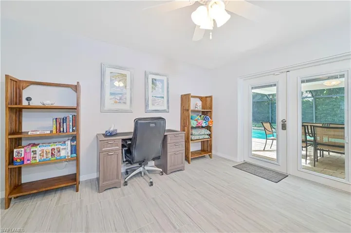 Office with ceiling fan, french doors, and light hardwood / wood-style floors