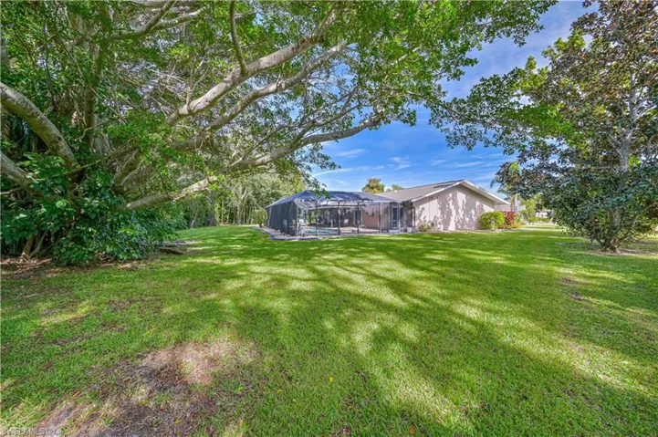 View of yard featuring a lanai