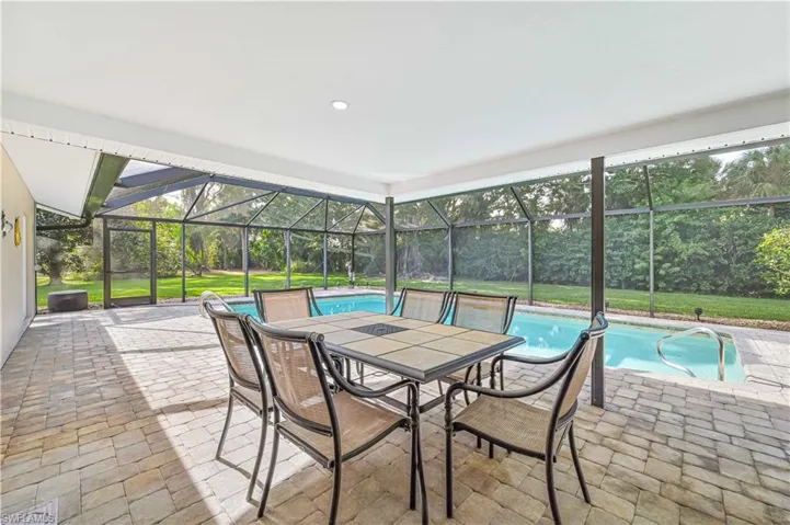 Unfurnished sunroom with a swimming pool